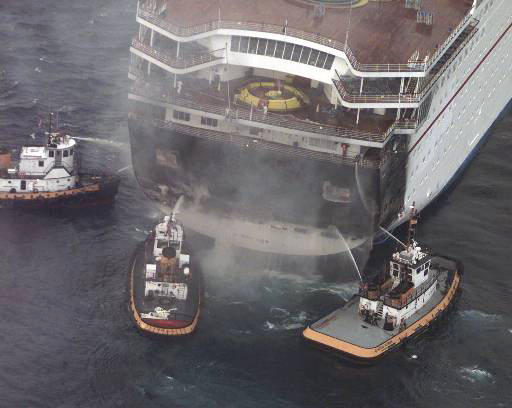 Tugboats putting out fire